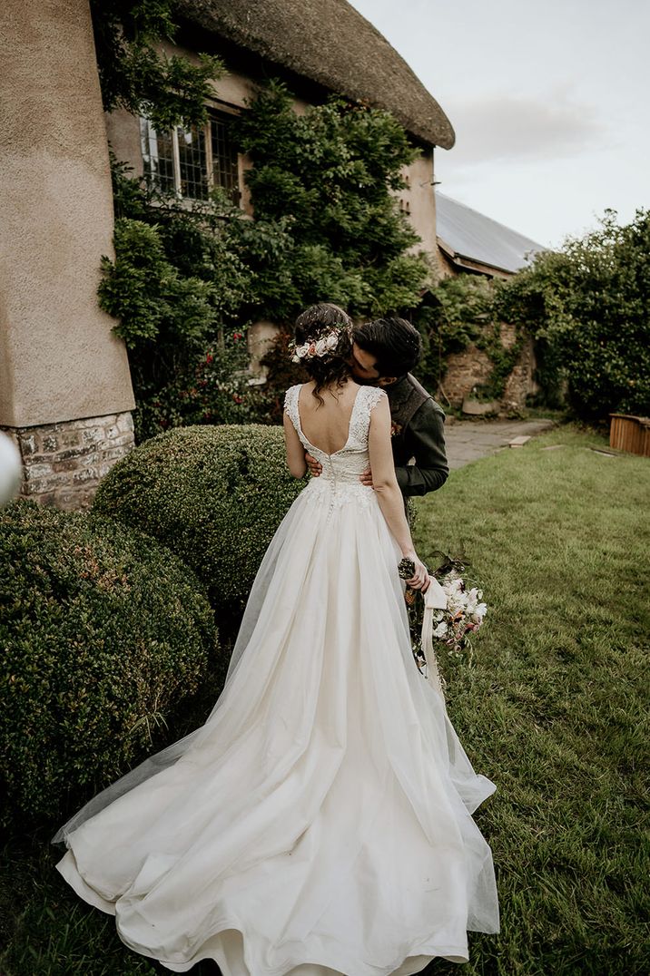 Low back, button up princess wedding dress with flowing train by Recommended Supplier Elena Popa Photography