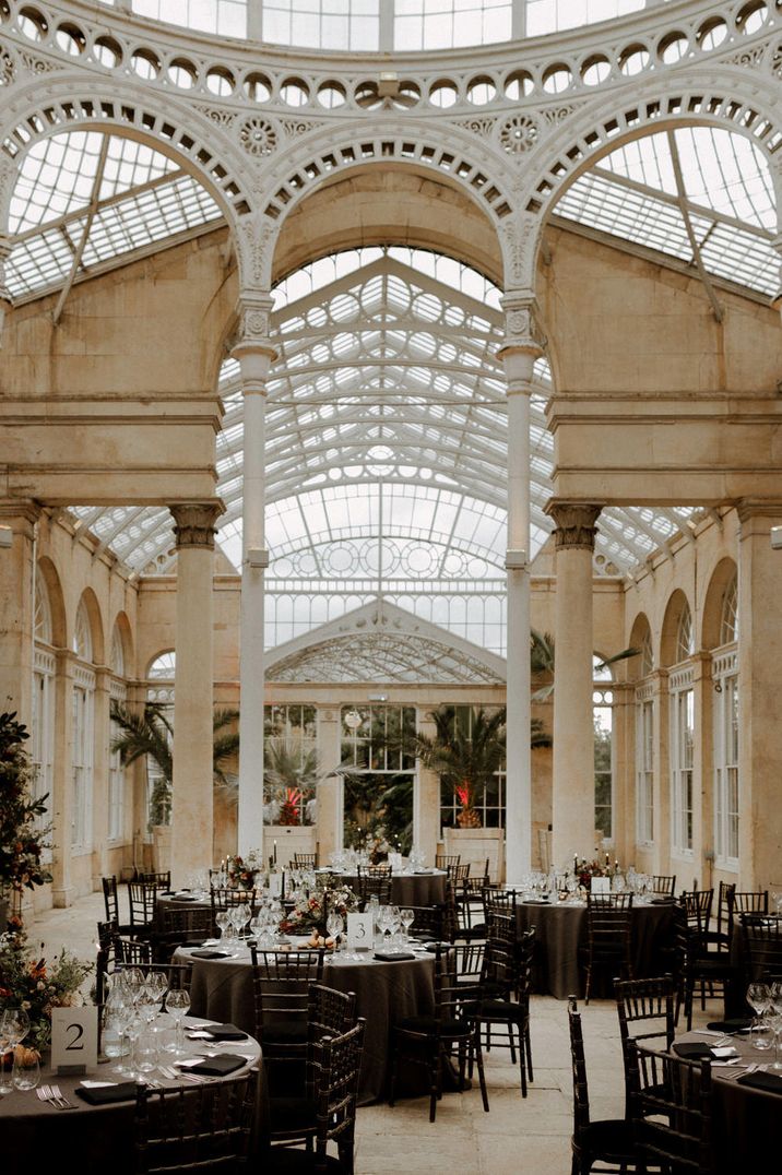 Syon Park wedding reception with dark opulent decor and autumnal flowers 