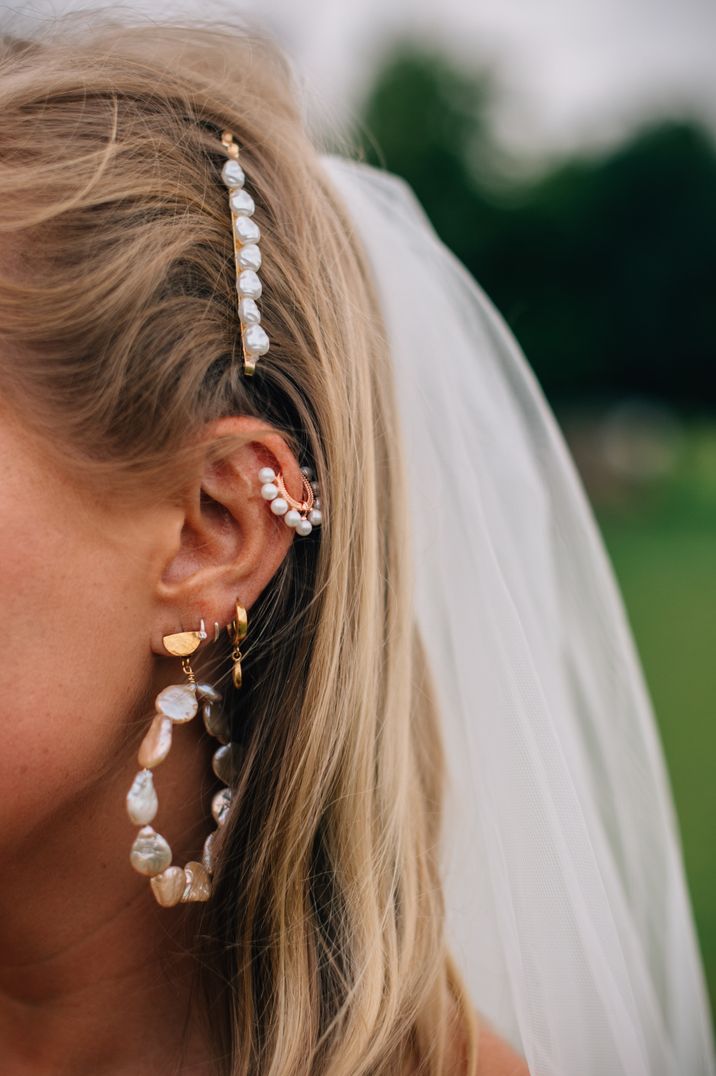 Bride wearing matching hoop and cuff earrings wedding jewellery 