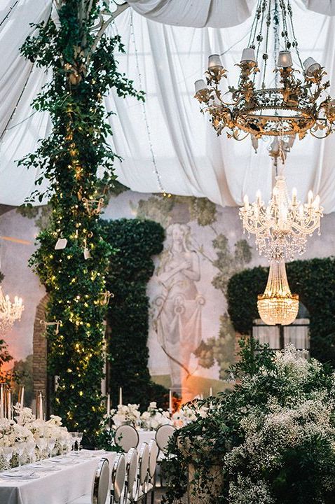 foliage-and-chandeliers-decorate-wedding-breakfast