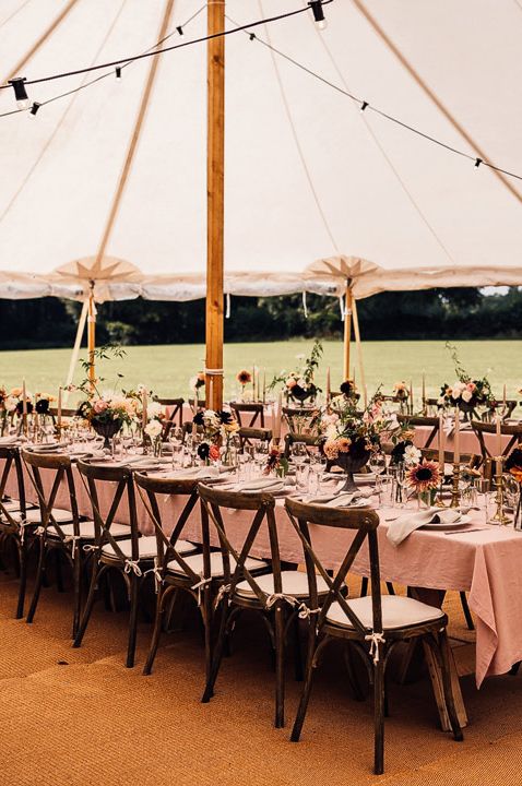 Neutral wedding tablescape with neutral, earthy napkins and plants