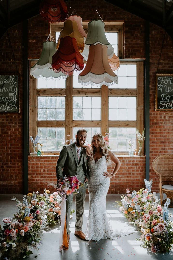 The Giraffe Shed wedding venue in Wales decorated with colourful wildflowers and velvet chandeliers 