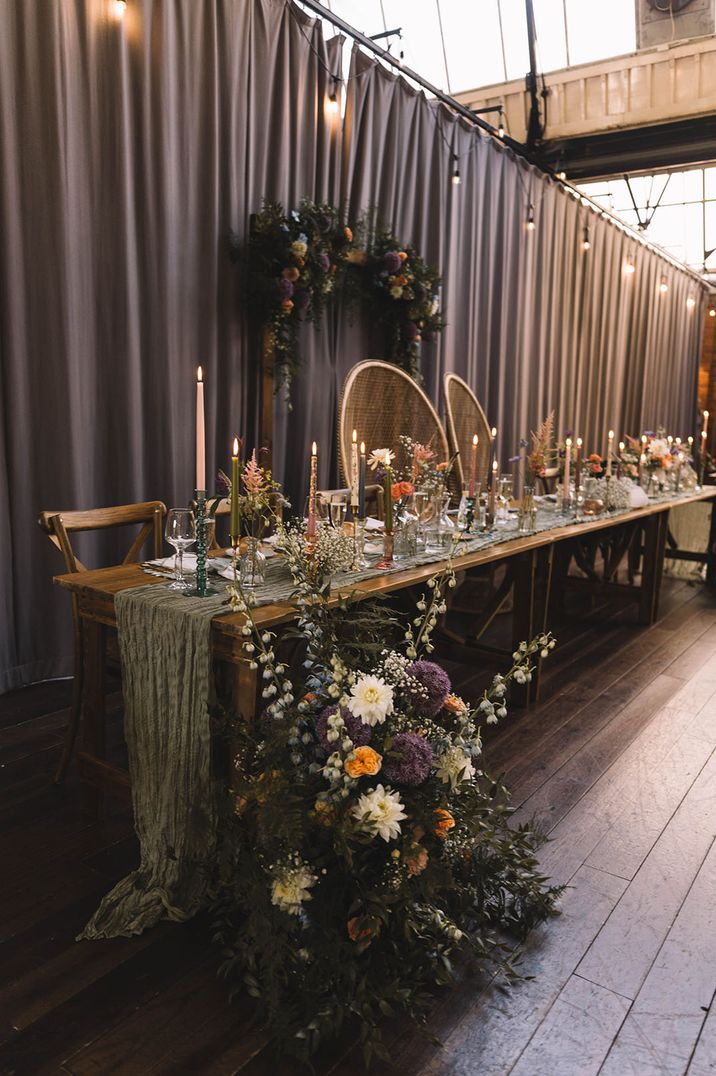 Top table at Bowers Mill wedding venue in Yorkshire with colourful pastel theme 