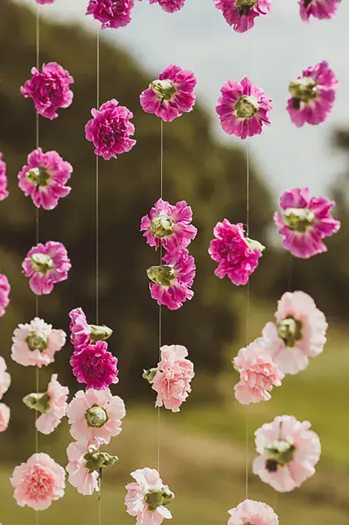 Hanging flower chain decor with pink wedding flowers by Matt Penberthy Photography 