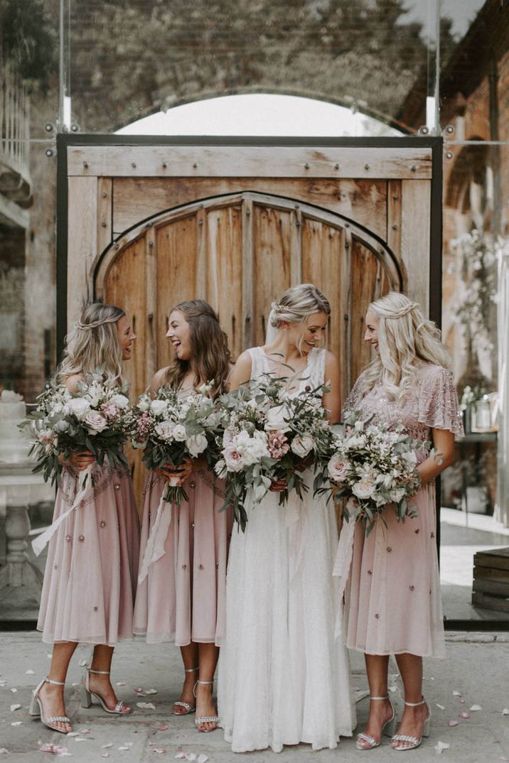 bridesmaid dresses with jackets Whimsical Bridesmaids with Mismatched Blue Dresses and Denim Jackets