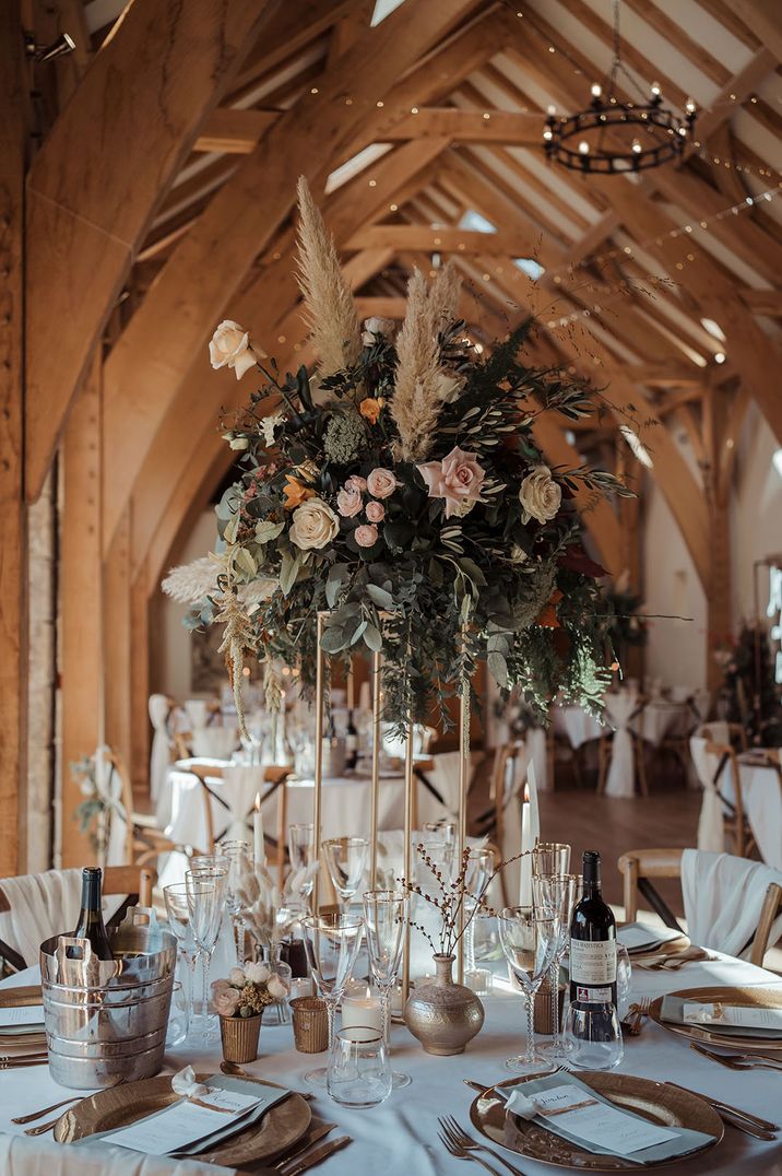 Tall pink rose table centrepiece with pampas with fairy lights 