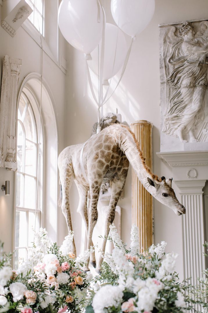 Hanging giraffe at Aynhoe Park luxury wedding venue