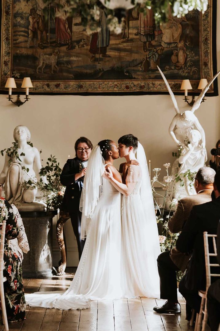 Lesbian wedding at Elmore Court with two brides in lace and tulle dresses 