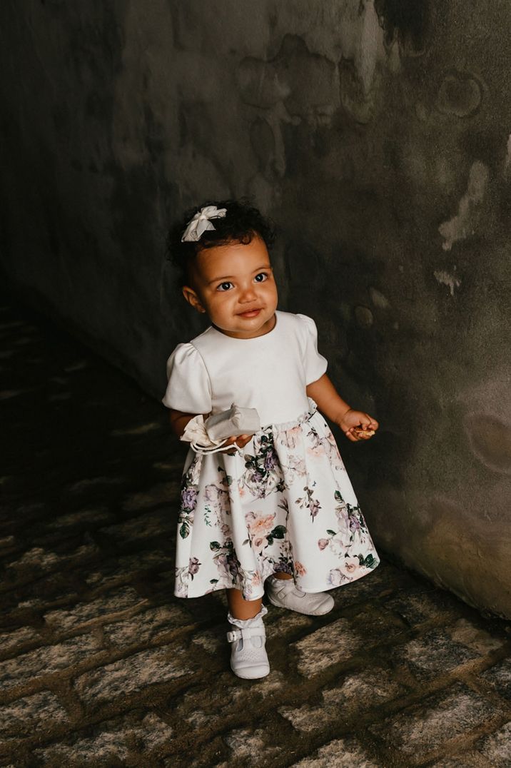 Flower girl in floral dress with small puff sleeves | Jessica Hopwood Photography | 