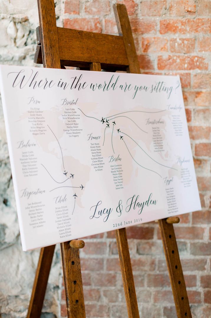 Pale pink and black world map wedding table plan 