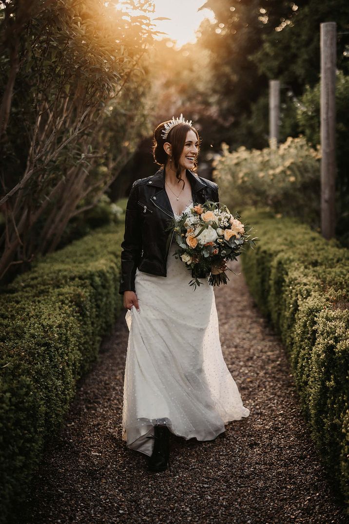 Quartz crystal crown with the bride wearing a black leather cover-up for winter wedding 