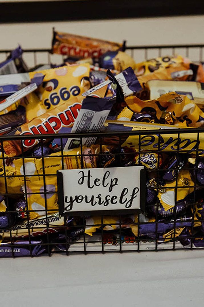 Basket full of chocolate bars as wedding favours for guests 