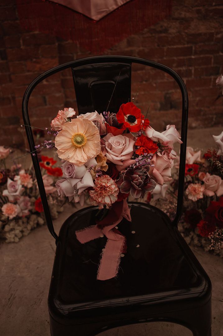 Pink and red wedding bouquets with carnations, anemones and roses 