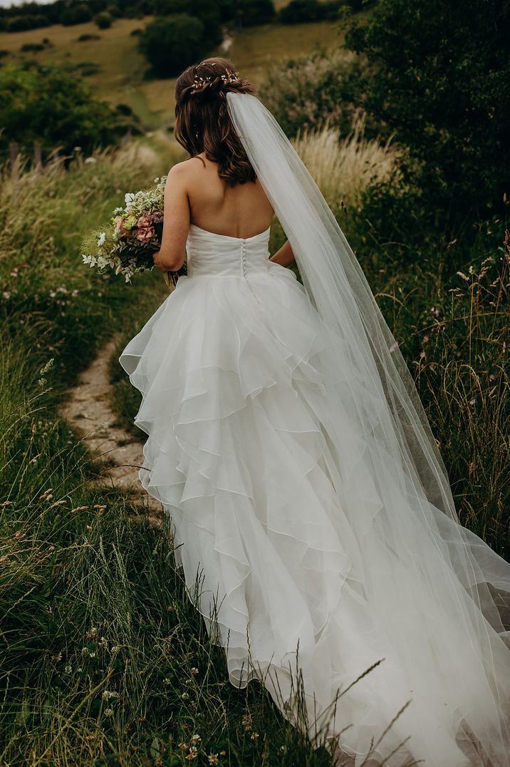 Layered ruffle skirt princess wedding dress and flowing long veil by Recommended Supplier Richard Skins Photography