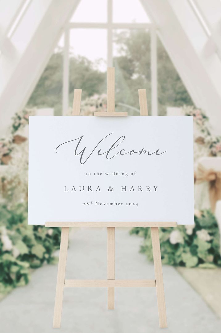 Wooden wedding easel holding black and white welcome sign for classic and traditional wedding 