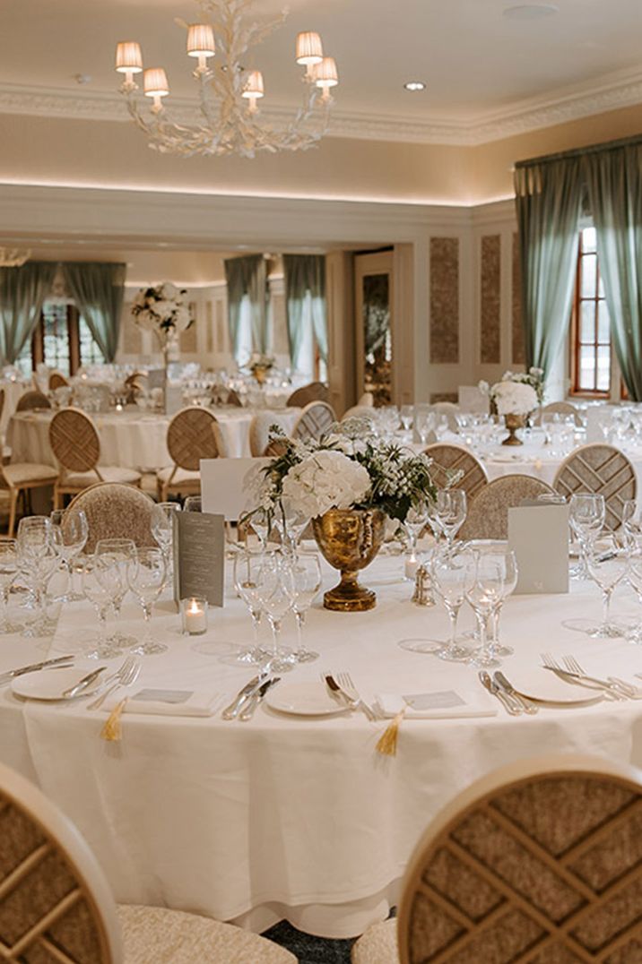 Luxe country house wedding tablescape with white table decorations and flowers 