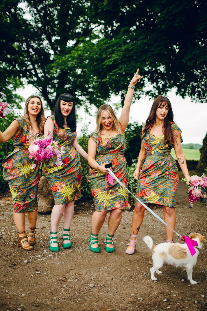 Bridesmaids in patterned Vivienne Westwood dresses with pink bouquets 