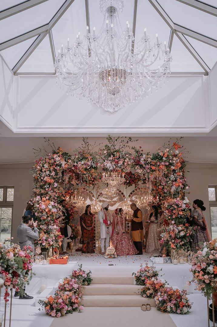 Large mandap flower decorations for Indian wedding at Offley Place 