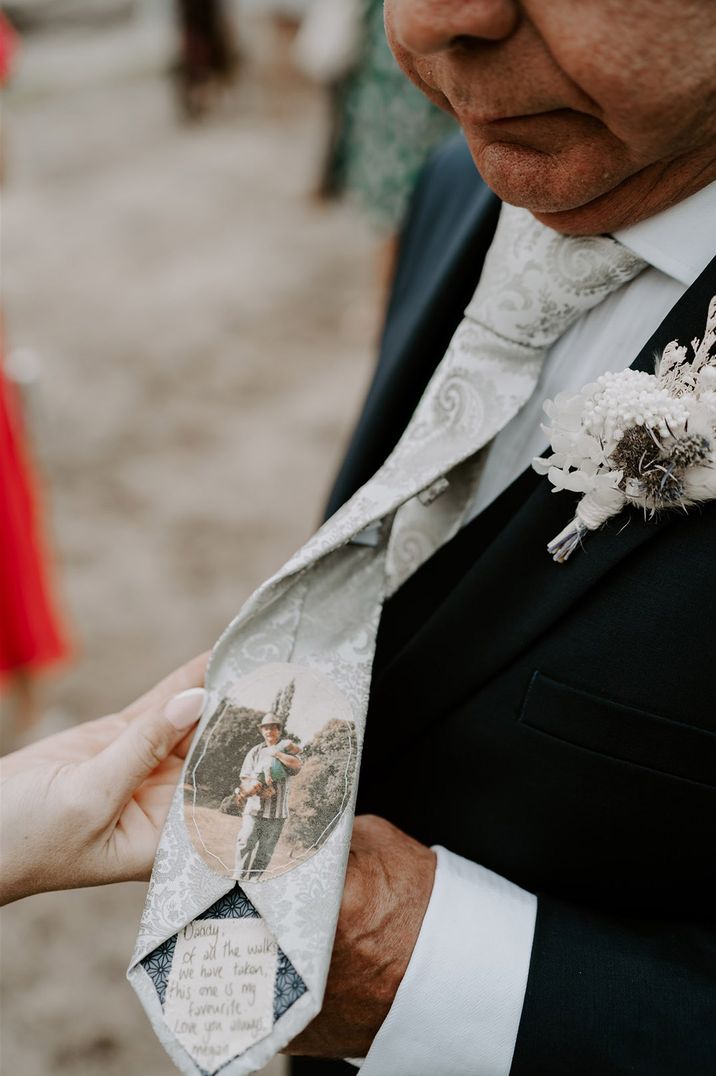 Father of the bride wears a tie personalised with a message from the bride and an image sewn on 