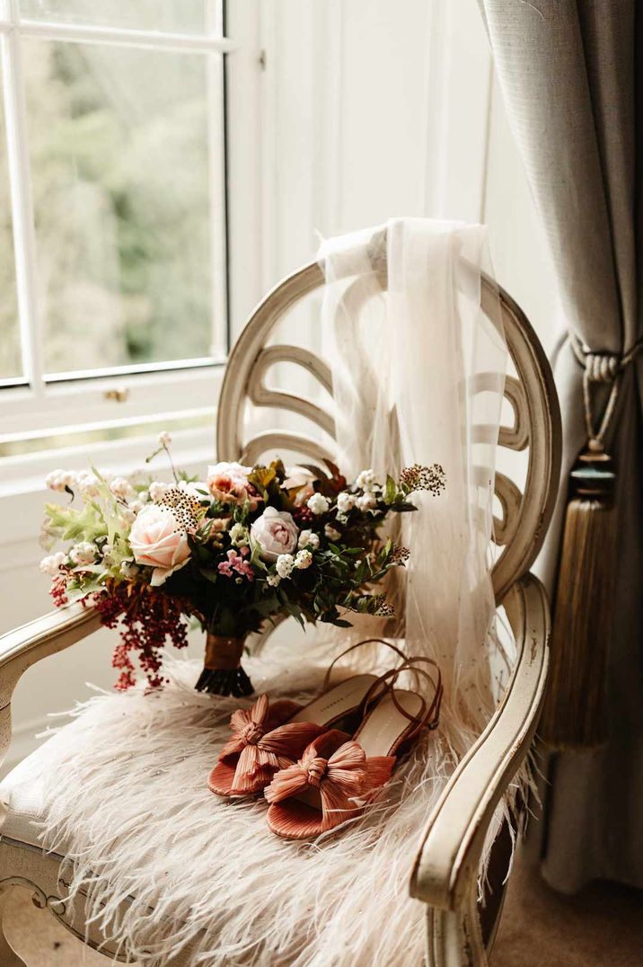 Rose and autumnal flower bouquet with Loeffler Randall wedding shoes and veil at Drumtochty Castle wedding