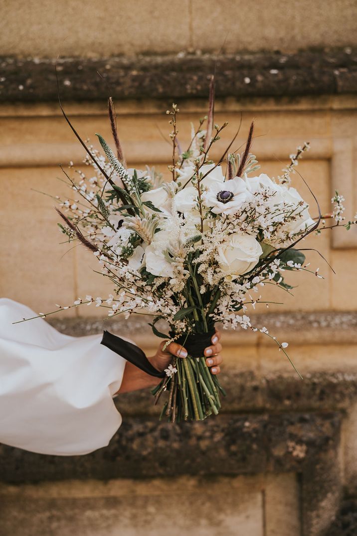 Monochrome white wedding bouquet with anemones and more 