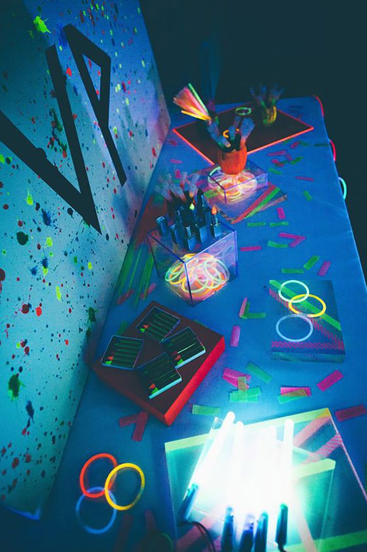 Party room with neon lights, glow sticks and fluorescent pens 