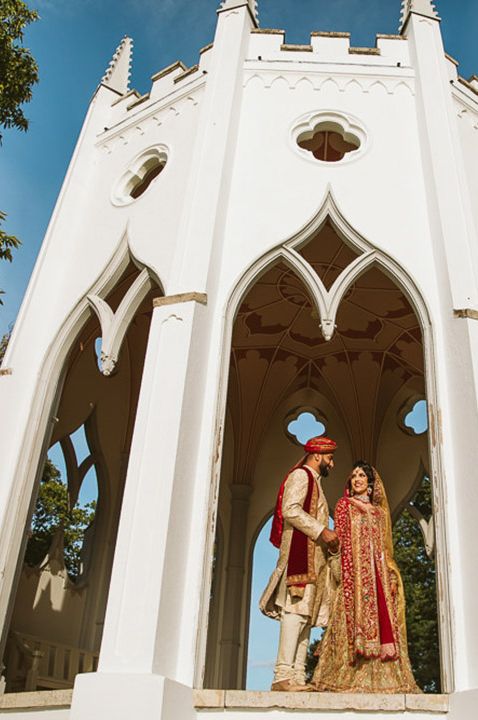 Muslim wedding with bride and groom in traditional wedding attire at their outdoor wedding venue 