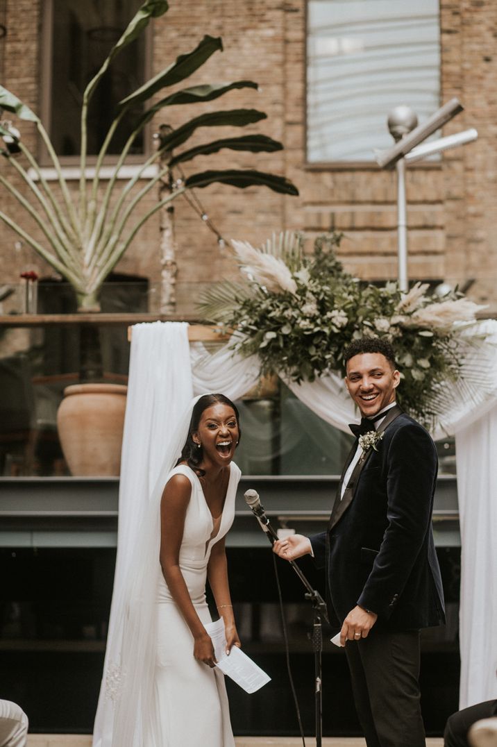 Devonshire Terrace Wedding in London with drapes, greenery and dried grasses 