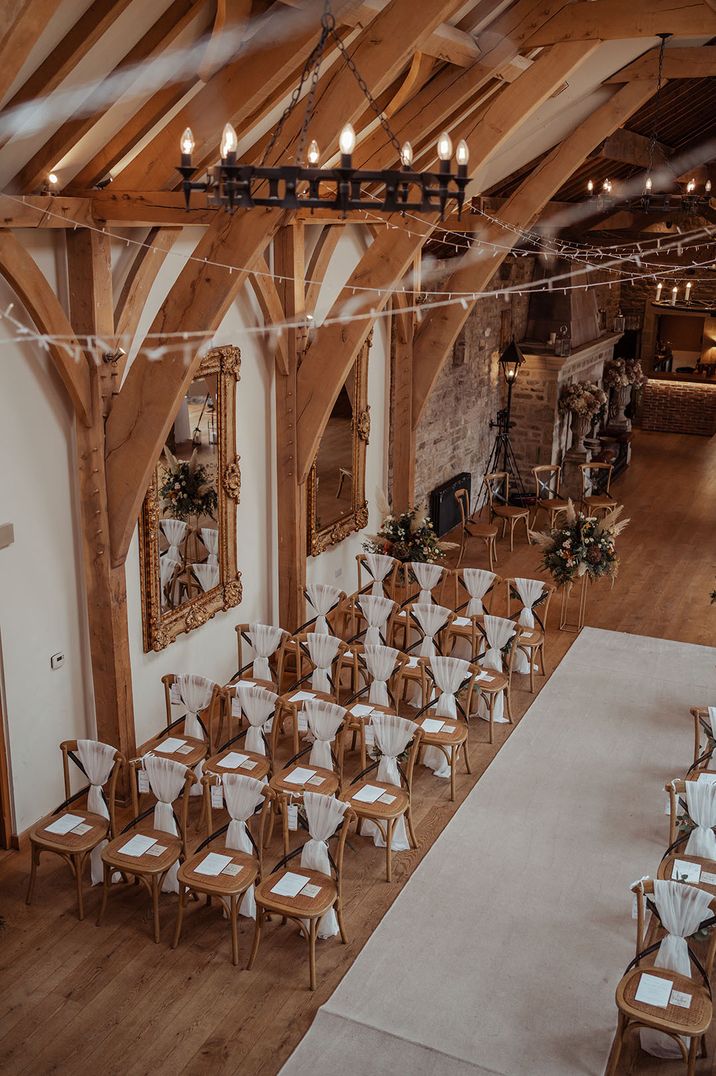 Indoor barn wedding venue with classic oak beams at The Saddle Room 