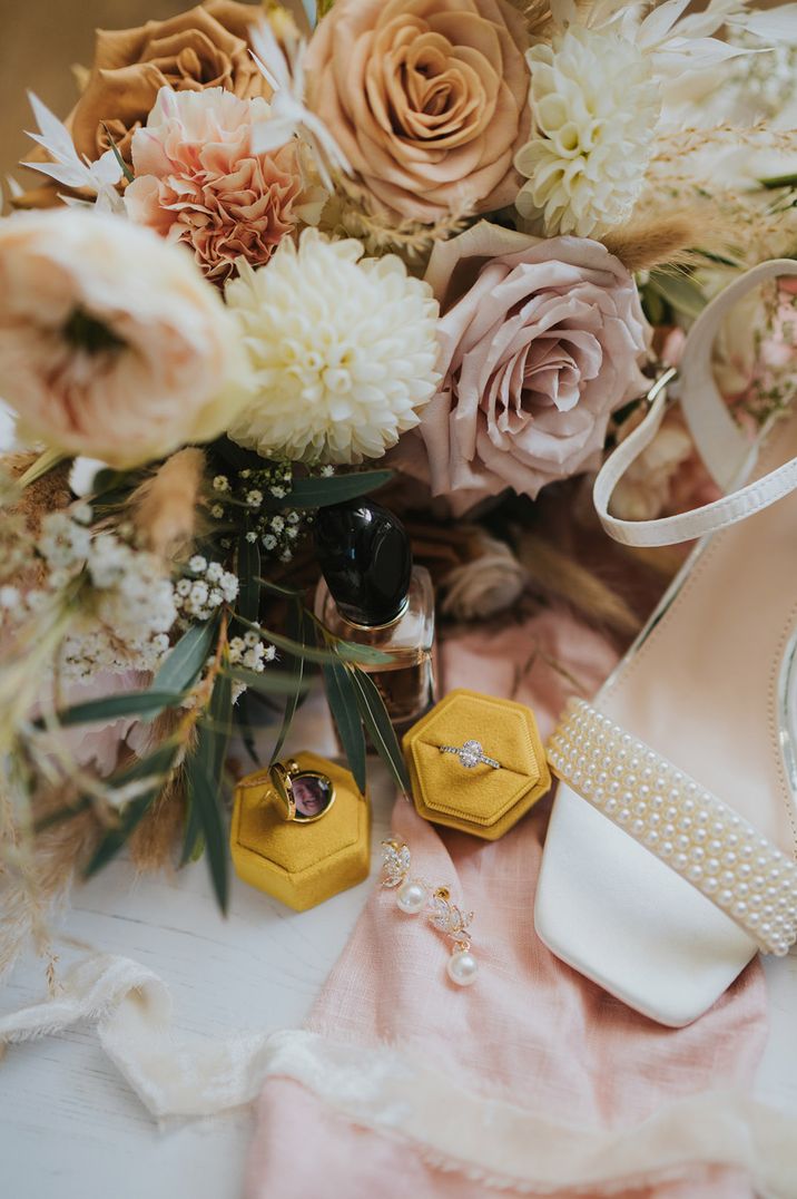 Bright yellow ring box with diamond ring for how to clean your engagement ring 