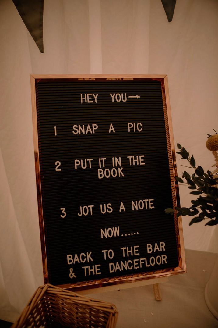 Wedding sign asking guests to take selfies with the polaroid camera for a wedding guest book 