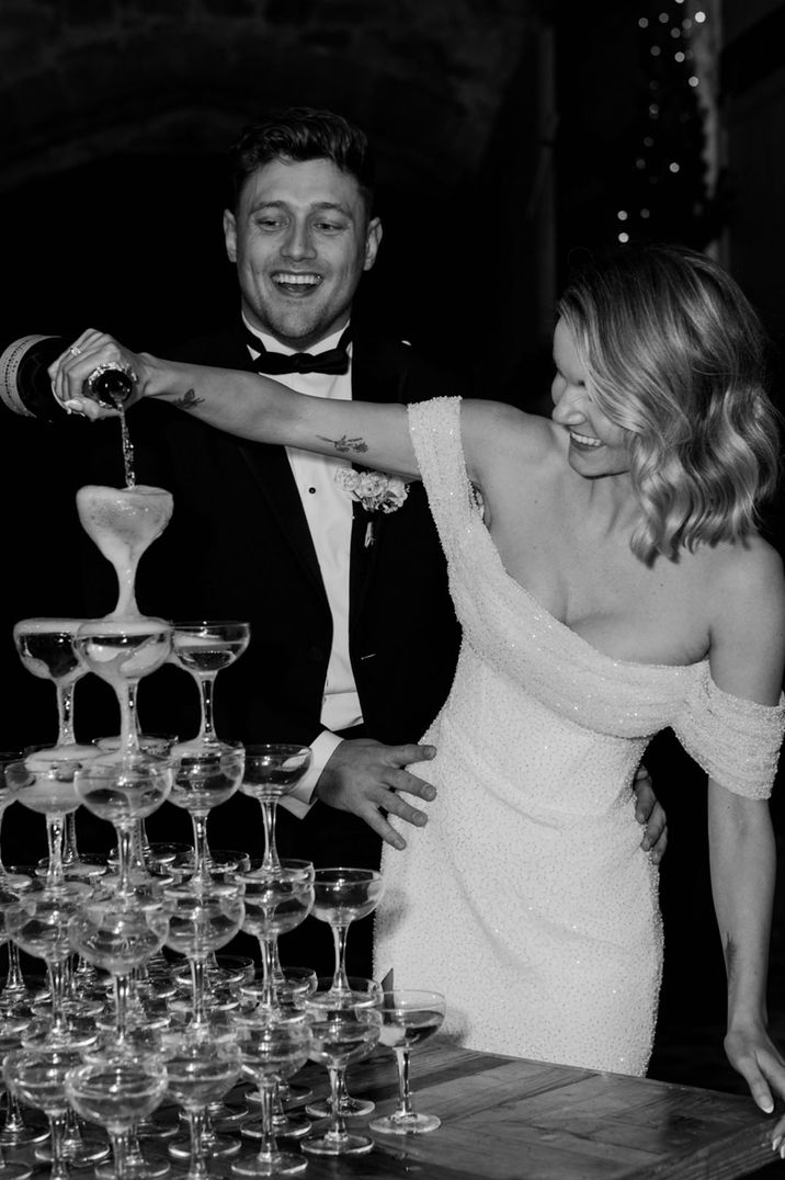 Wyresdale Park wedding with the bride and groom pouring their champagne tower 