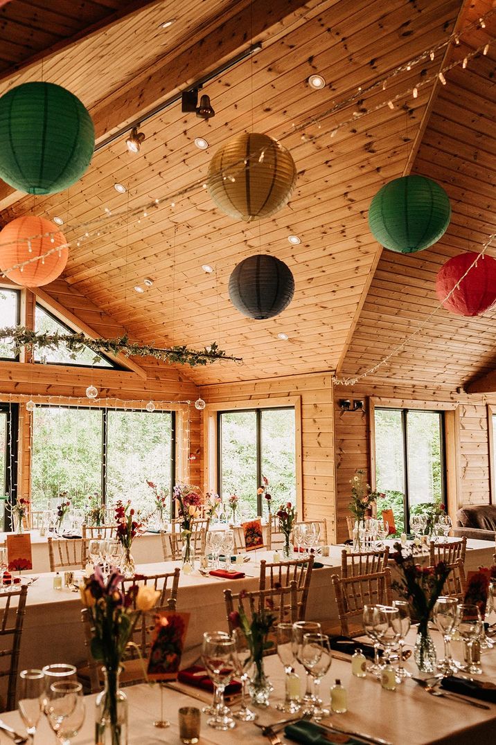 Styal Lodge rustic wedding venue with colourful paper lantern decorations