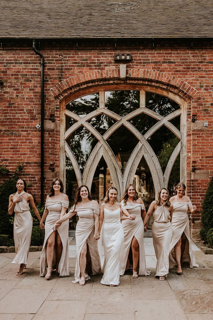 Bridal party in champagne bridesmaid dresses at Shustoke Barn Farms 