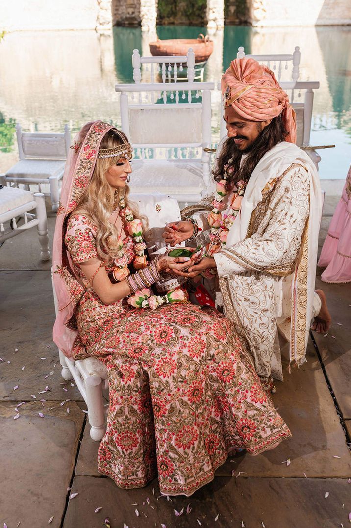 Hindu wedding ceremony at The Lost Orangery, Euridge Manor with bride in a pink Saree and groom a gold jacket 