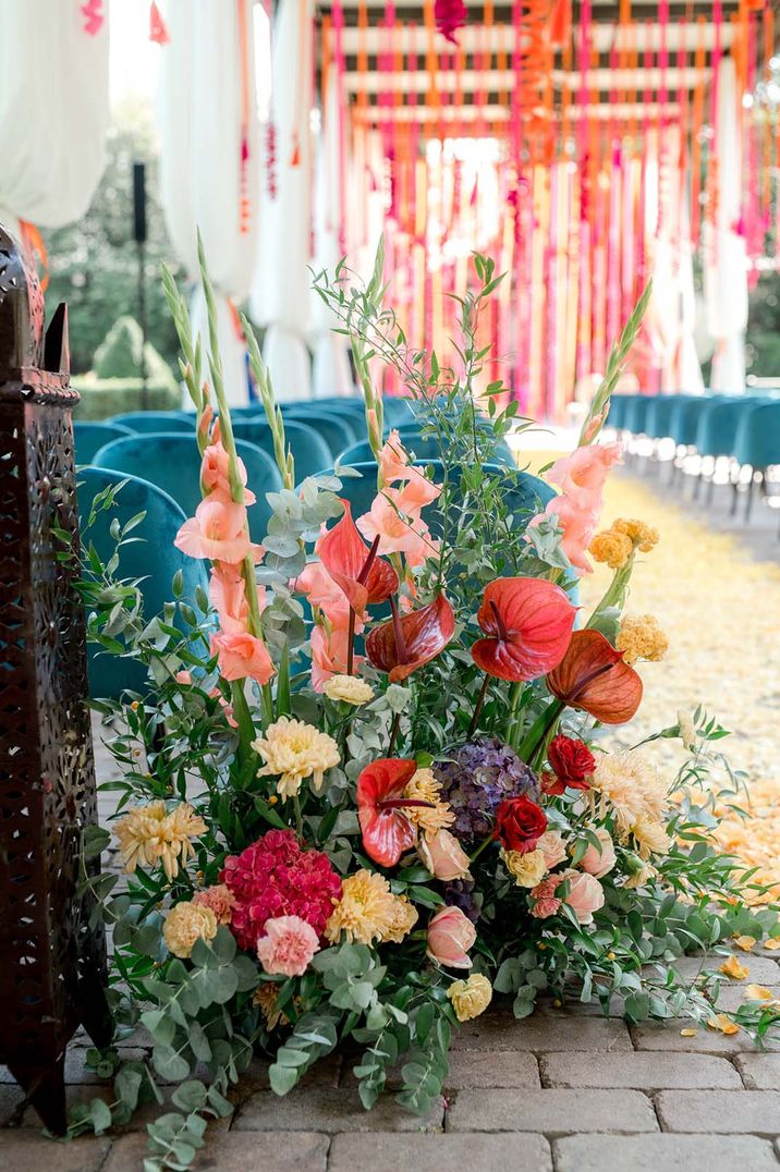 Aisle wedding flowers with pink gladiolus, red anthuriums and more for vibrant hot pink and orange wedding over 60k 