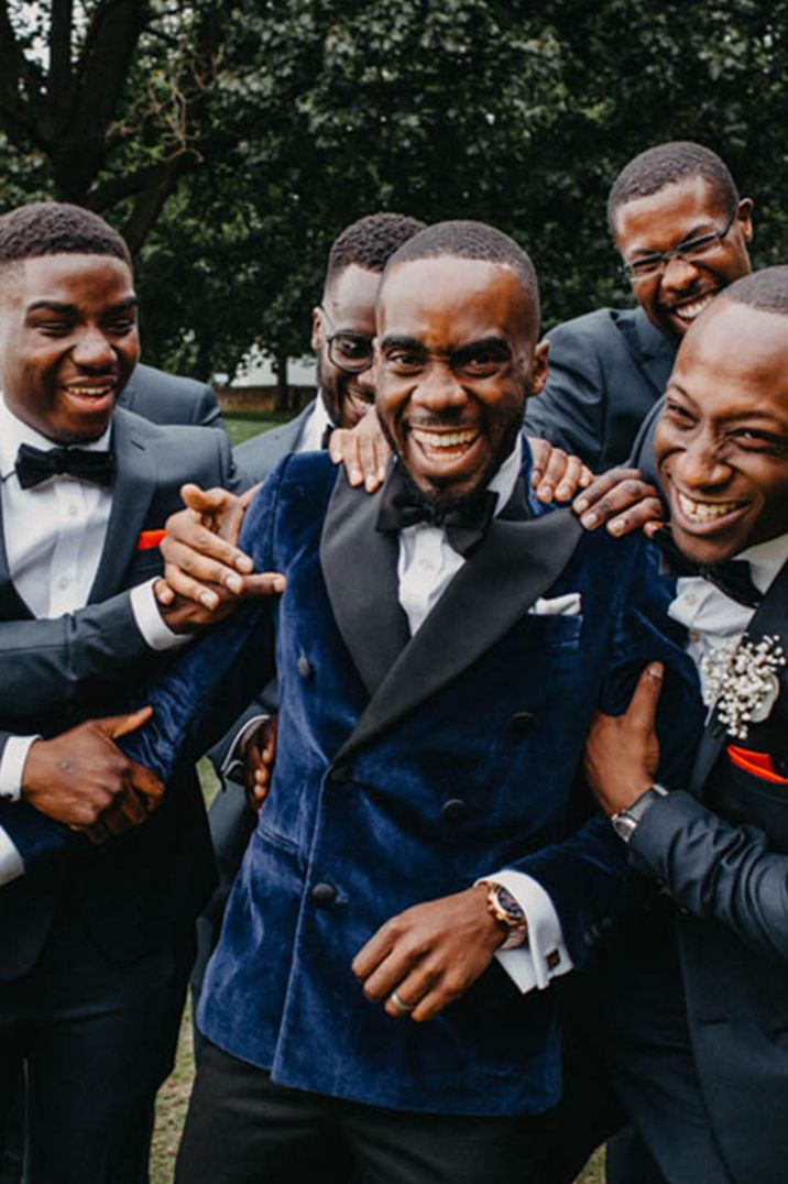 Groom and groomsmen partying together to celebrate the wedding 