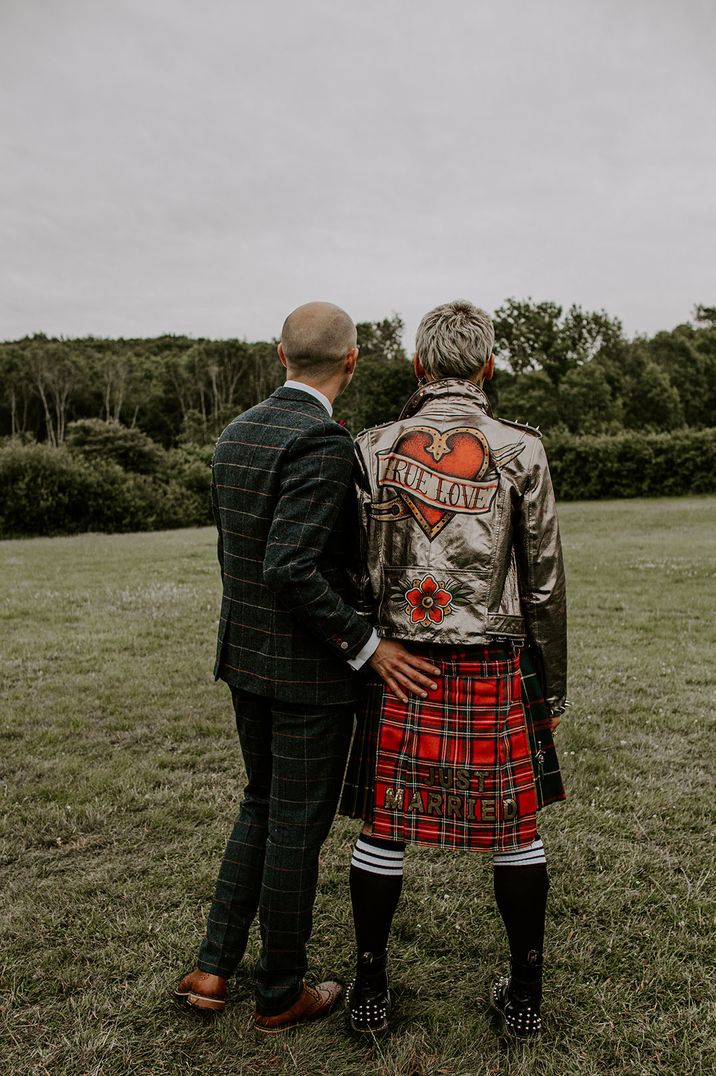 Groom in metallic leather jacket with studs and unique custom design for the wedding 