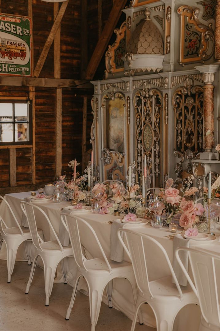 Anthuriums, orchids, and rose wedding table decorations with pink candle arrangements 