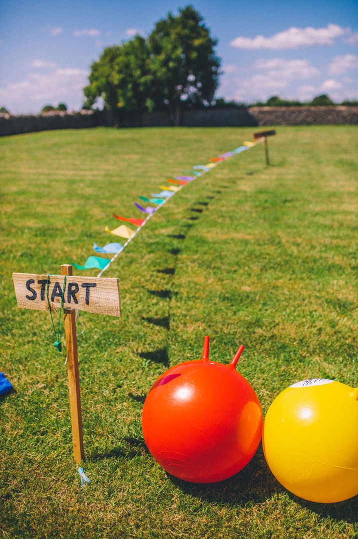 Colourful red and yellow space hopper outdoor wedding games 