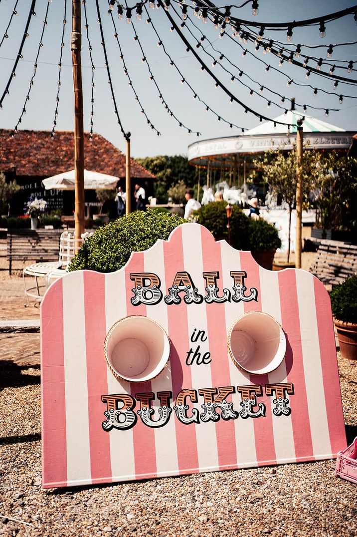 Fun carnival game with baskets at Preston Court wedding 