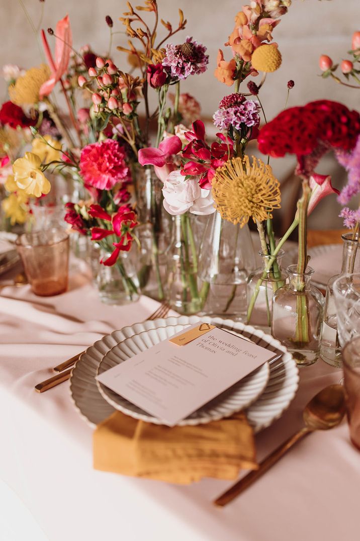 Simple and minimal pink wedding menu stationery with colourful wildflower decor 