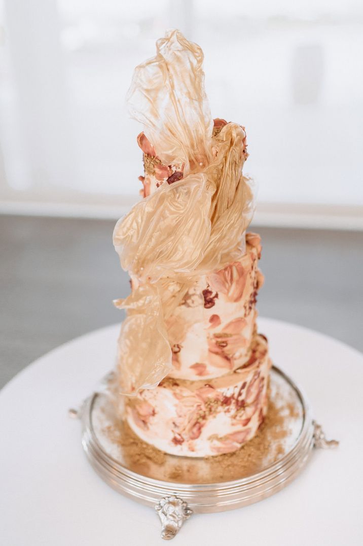 Burgundy and pink buttercream wedding cake with sugar decoration 