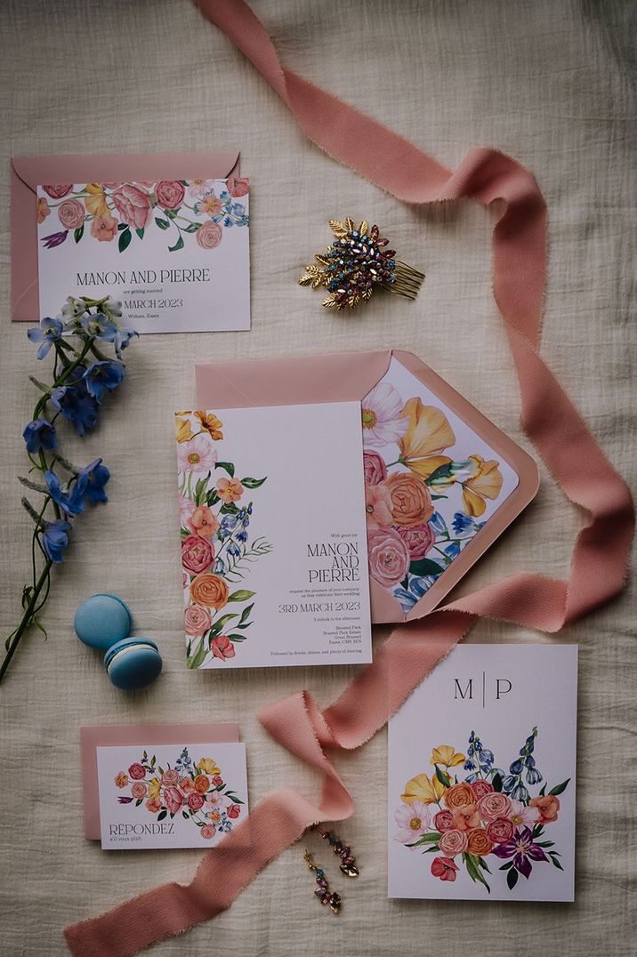 Pink envelopes and floral wedding invitations and save the dates for spring inspired wedding 