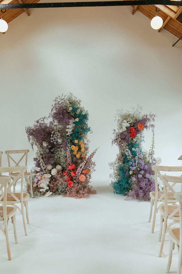 Coloured gypsophila wedding column flowers with orchids, roses, anthuriums and more for fun and bright wedding 