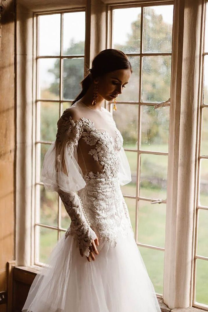 Emma Beaumont wearing long sleeve illusion neckline wedding dress with lace detailing 