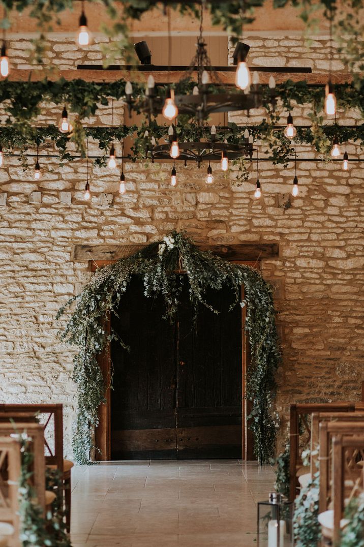 Caswell House wedding venue with foliage decor and festoon lights 