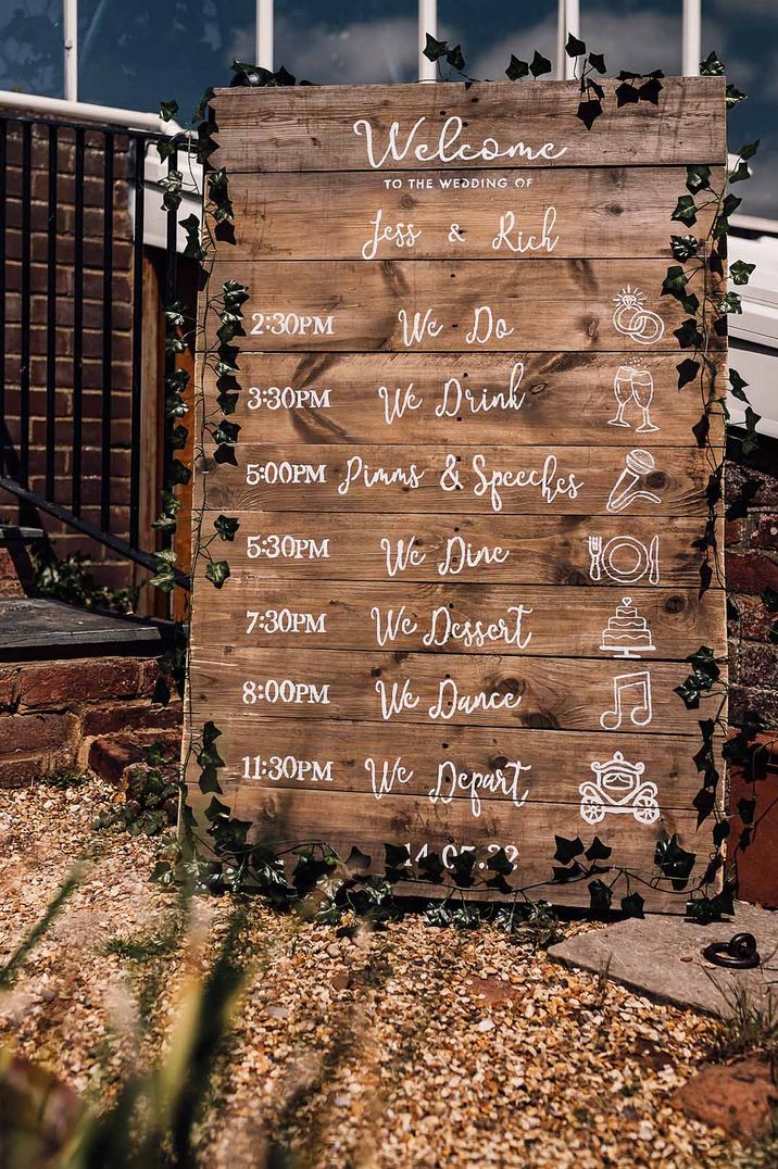 Rustic wooden order of the day wedding sign 