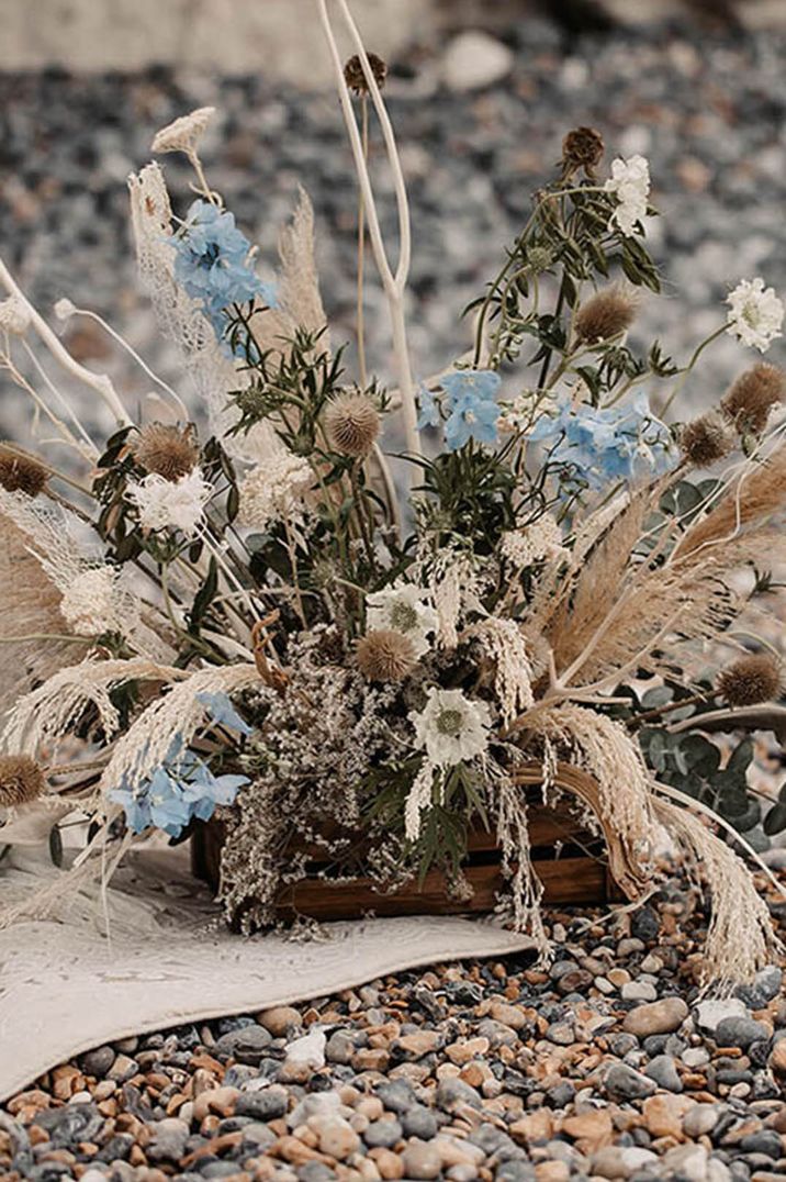 Coastal wedding elopement with pastel blue flowers, pampas grass and dried wedding flowers 