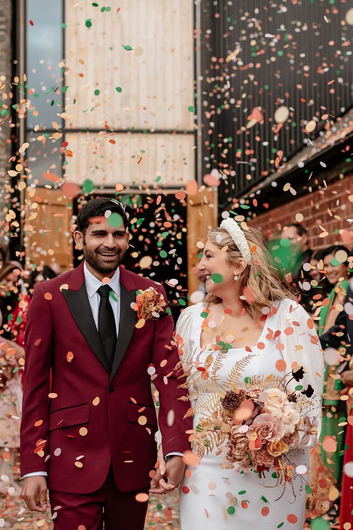 Colourful confetti moment for the bride and groom 